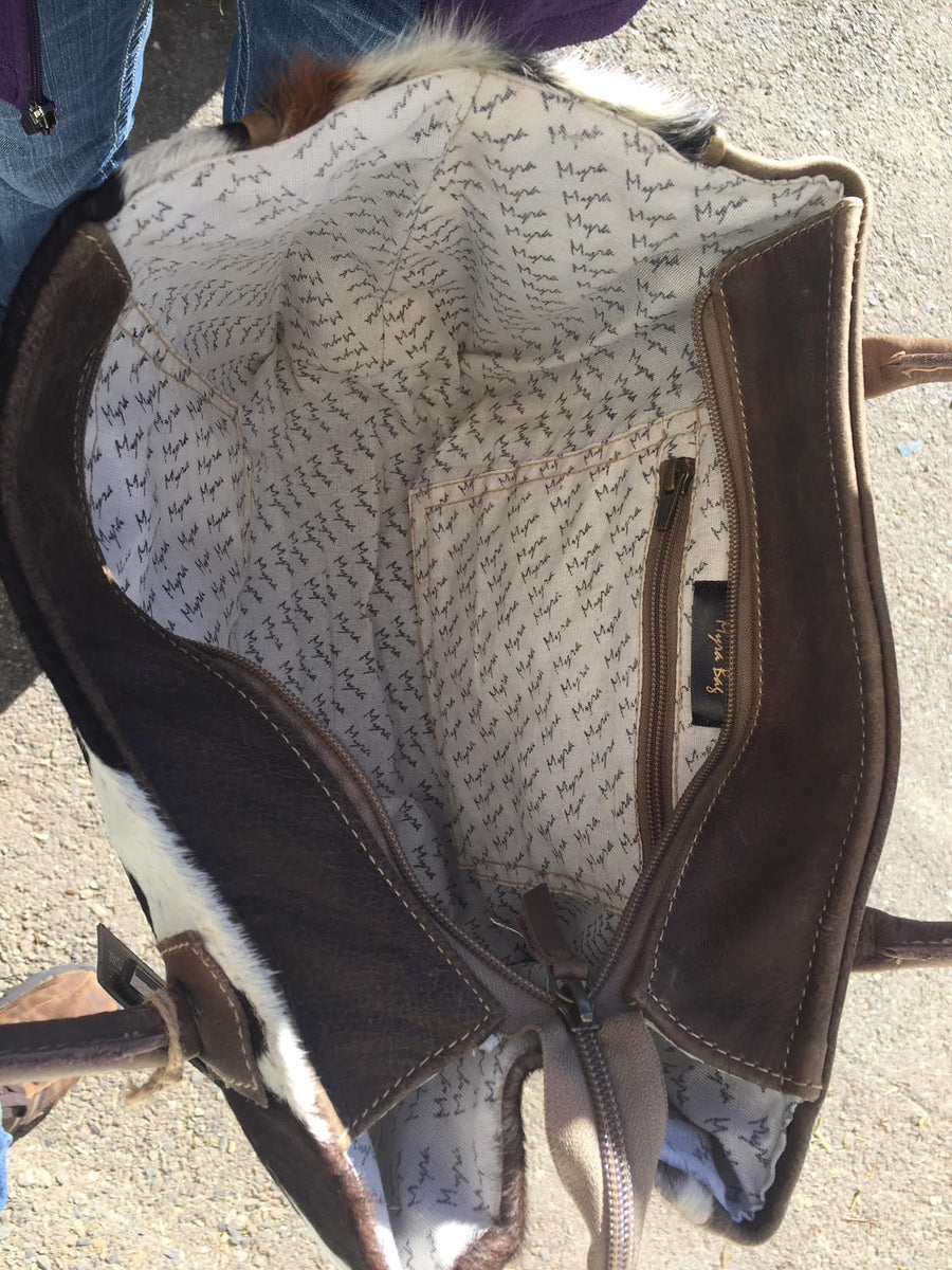 Purse with leather and hot hair on details.